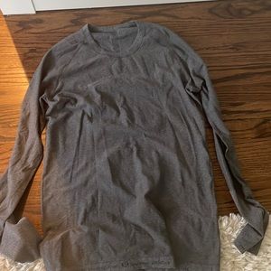 Grey lululemmon shirt not super tight on you but not to loose